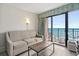 Living room with ocean view and balcony access at 2207 S Ocean Blvd. # 1521, Myrtle Beach, SC 29577