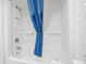 Bathroom with a shower/tub combo and blue shower curtain at 2207 S Ocean Blvd. # 911, Myrtle Beach, SC 29577