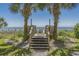 Wooden steps lead to a sandy beach with ocean views at 2207 S Ocean Blvd. # 921, Myrtle Beach, SC 29577