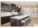 Open kitchen with large island and dark cabinets at 792 Indigo Bay Circle, Myrtle Beach, SC 29579
