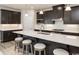 Open kitchen with large island and dark cabinets at 792 Indigo Bay Circle, Myrtle Beach, SC 29579