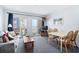 Living room with ocean view, sofa, table, and chairs at 920 N Waccamaw Dr. # 2106, Garden City Beach, SC 29576