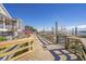 Wooden boardwalk near waterfront restaurants and boats at 920 N Waccamaw Dr. # 2106, Garden City Beach, SC 29576