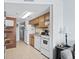Well-equipped kitchen featuring white appliances and wood cabinets at 920 N Waccamaw Dr. # 2106, Garden City Beach, SC 29576