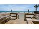 Beach access with wooden walkway and seating at 920 N Waccamaw Dr. # 2106, Garden City Beach, SC 29576