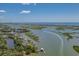 Aerial view of waterfront property with boat and pier at 920 N Waccamaw Dr. # 2106, Garden City Beach, SC 29576