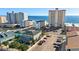Aerial view of beachfront property showing building and parking lot at 920 N Waccamaw Dr. # 2106, Garden City Beach, SC 29576