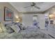 Coastal-themed bedroom with king-size bed and private balcony access at 4601 Greenbriar Dr. # 206A, Little River, SC 29566