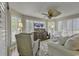 Relaxing living room featuring comfy seating, large TV, and abundant natural light at 4601 Greenbriar Dr. # 206A, Little River, SC 29566