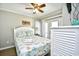 Bedroom with a queen bed, coastal decor, and access to balcony at 6001 South Kings Hwy., Myrtle Beach, SC 29575