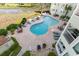 Community pool with plenty of lounge chairs at 9400 Shore Dr. # 308, Myrtle Beach, SC 29572