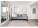 Living room with comfy couch, access to balcony, and light flooring at 9400 Shore Dr. # 308, Myrtle Beach, SC 29572