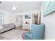 Living area with gray couch, white accent chairs, and a view into bedroom at 9400 Shore Dr. # 308, Myrtle Beach, SC 29572
