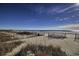 Beachfront property with sandy beach, dune vegetation, and wooden fence at 1087 Saltgrass Way, Myrtle Beach, SC 29588