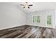 Bright living room with vinyl plank flooring, recessed lighting, and a ceiling fan at 137 Six Mile Creek Dr., Georgetown, SC 29440