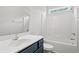 Clean bathroom with a tub/shower combo and navy vanity at 137 Six Mile Creek Dr., Georgetown, SC 29440