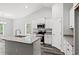 Open concept kitchen with island, granite countertops, and stainless steel appliances at 137 Six Mile Creek Dr., Georgetown, SC 29440