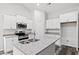 Modern kitchen featuring white cabinets, granite countertops, and stainless steel appliances at 137 Six Mile Creek Dr., Georgetown, SC 29440
