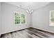 Spacious dining area with hardwood floors and a modern chandelier at 137 Six Mile Creek Dr., Georgetown, SC 29440