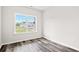 Bright bedroom with large window and wood-look flooring at 137 Six Mile Creek Dr., Georgetown, SC 29440