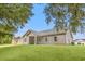 Ranch home with covered patio and landscaped yard at 137 Six Mile Creek Dr., Georgetown, SC 29440