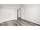 Well-lit bedroom with double doors and wood-look floors at 137 Six Mile Creek Dr., Georgetown, SC 29440