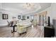 Bright living room with hardwood floors and access to balcony at 9994 Beach Club Dr. # 703, Myrtle Beach, SC 29572