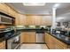 Updated kitchen with granite countertops and wood cabinets at 9994 Beach Club Dr. # 703, Myrtle Beach, SC 29572