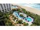 Aerial view of resort complex with multiple pools and beach access at 9994 Beach Club Dr. # 703, Myrtle Beach, SC 29572