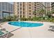 Community pool with lounge chairs for sunbathing at 9994 Beach Club Dr. # 703, Myrtle Beach, SC 29572