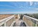 Convenient beach access via boardwalk steps leading to sandy shores at 2311 S Ocean Blvd. # 341, Myrtle Beach, SC 29577