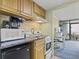 Small kitchenette with granite countertops and modern appliances at 2311 S Ocean Blvd. # 341, Myrtle Beach, SC 29577