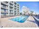 Inviting rectangular pool with surrounding lounge chairs at 2311 S Ocean Blvd. # 341, Myrtle Beach, SC 29577