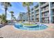 Relaxing kidney-shaped pool with palm trees nearby at 2311 S Ocean Blvd. # 341, Myrtle Beach, SC 29577