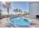 Relaxing kidney-shaped pool with palm trees nearby at 2311 S Ocean Blvd. # 341, Myrtle Beach, SC 29577