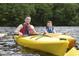 Father and son enjoying kayaking on calm waters at 1593 Highway 701 South, Loris, SC 29569