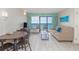 Living room with sofa, table, and ocean view at 2207 S Ocean Blvd. # 915, Myrtle Beach, SC 29577