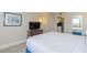 King bed, dresser, and view into kitchenette at 2207 S Ocean Blvd. # 915, Myrtle Beach, SC 29577