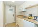 Small kitchen with microwave, sink, and mini-fridge at 2207 S Ocean Blvd. # 1105, Myrtle Beach, SC 29577