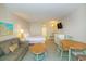 Bedroom with double bed, sofa, and dining table at 2207 S Ocean Blvd. # 1105, Myrtle Beach, SC 29577