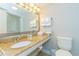 Bathroom with granite countertop, sink, and toilet at 2207 S Ocean Blvd. # 1105, Myrtle Beach, SC 29577
