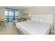 King-size bed, couch, and ocean view at 2207 S Ocean Blvd. # 1105, Myrtle Beach, SC 29577