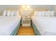 Bedroom with two double beds and a nightstand at 2207 S Ocean Blvd. # 1401, Myrtle Beach, SC 29577