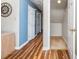 Hallway with light blue walls and wood-look floors at 775 Plantation Dr. # 88, Little River, SC 29566