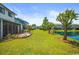 Landscaped backyard with pond and community view at 775 Plantation Dr. # 88, Little River, SC 29566