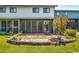 Screened-in patio with a brick paved area and landscaping at 775 Plantation Dr. # 88, Little River, SC 29566