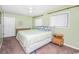 Light green bedroom with king-size bed and ample closet space at 775 Plantation Dr. # 88, Little River, SC 29566