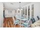Dining area with glass table and wicker chairs at 775 Plantation Dr. # 88, Little River, SC 29566