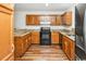 Kitchen with granite countertops and wood cabinets at 775 Plantation Dr. # 88, Little River, SC 29566