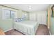 King-size bed in a light green bedroom with double closets at 775 Plantation Dr. # 88, Little River, SC 29566